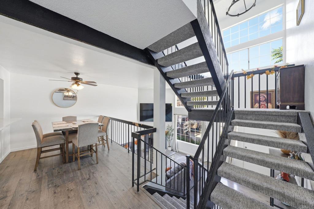 8765 Spring Canyon Drive Spring Valley, CA 91977 - Photo 21 of 37 a view of a dining room with furniture wooden floor and front door