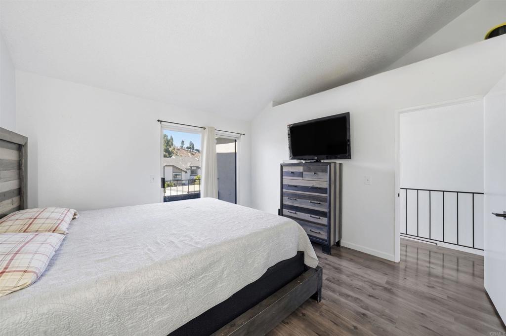 8765 Spring Canyon Drive Spring Valley, CA 91977 - Photo 23 of 37 a bedroom with a bed and a flat screen tv