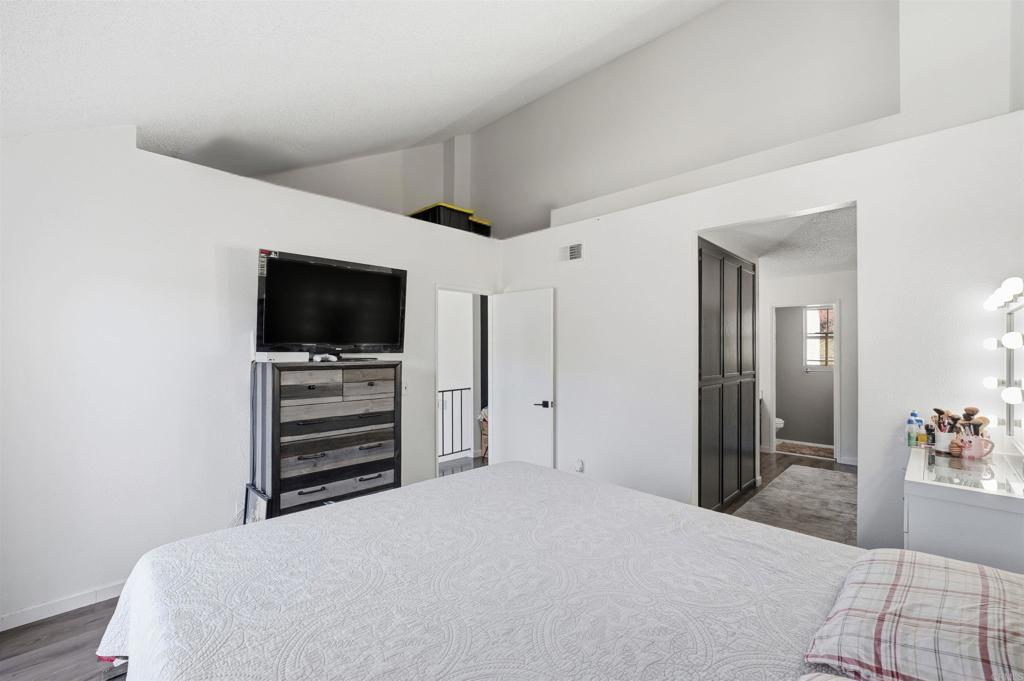 8765 Spring Canyon Drive Spring Valley, CA 91977 - Photo 24 of 37 a bedroom with a bed and a flat screen tv