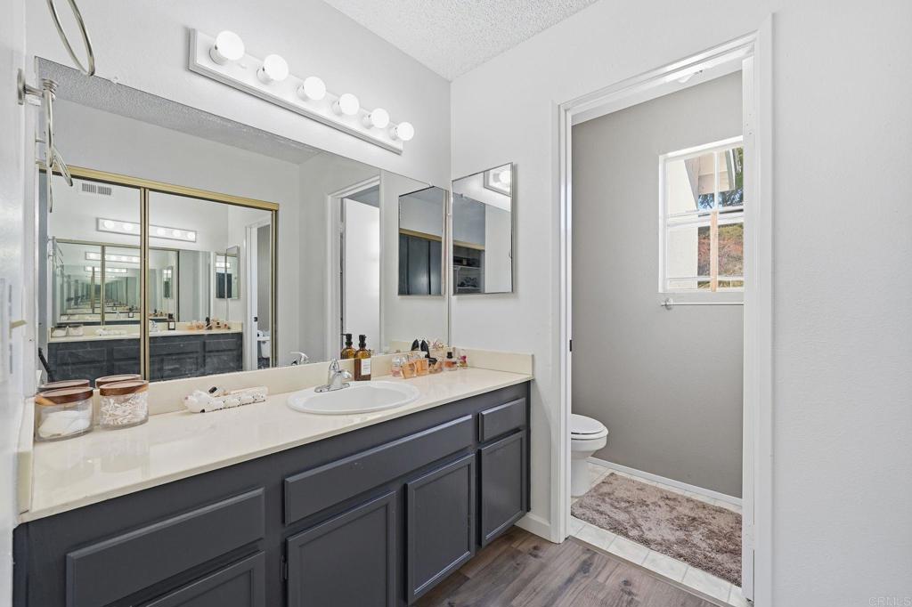 8765 Spring Canyon Drive Spring Valley, CA 91977 - Photo 25 of 37 a bathroom with 2 sink and a mirror