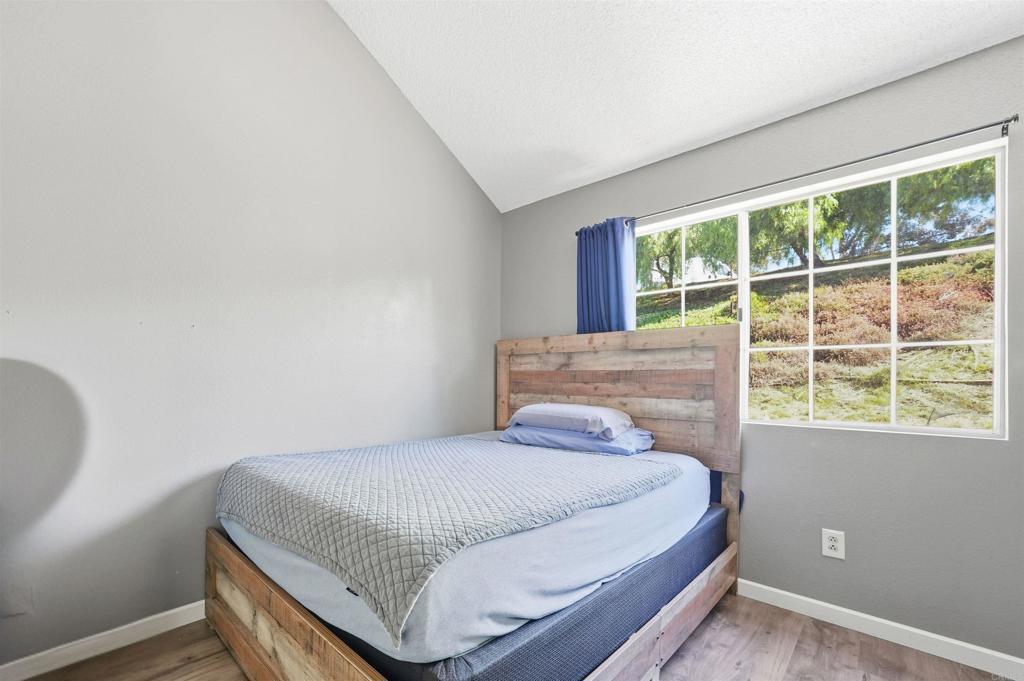 8765 Spring Canyon Drive Spring Valley, CA 91977 - Photo 28 of 37 a bedroom with a bed and window