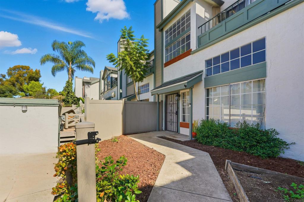 8765 Spring Canyon Drive Spring Valley, CA 91977 - Photo 3 of 37 a front view of a house with a yard