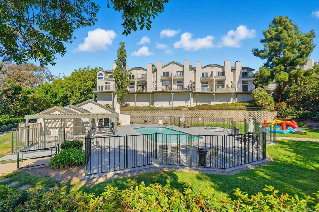 8765 Spring Canyon Drive Spring Valley, CA 91977 - Photo 37 of 37 a view of a house with a swimming pool and outdoor seating