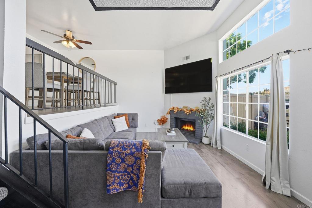 8765 Spring Canyon Drive Spring Valley, CA 91977 - Photo 7 of 37 a living room with furniture and a flat screen tv