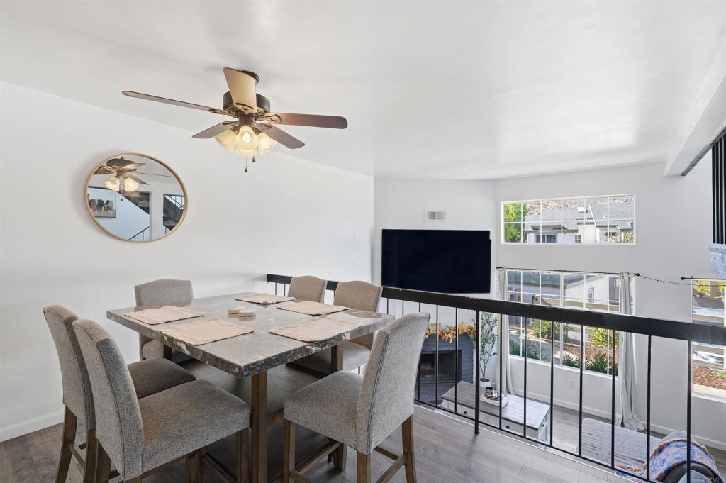 8765 Spring Canyon Drive Spring Valley, CA 91977 - Photo 9 of 37 a view of a dining room with furniture wooden floor and a chandelier
