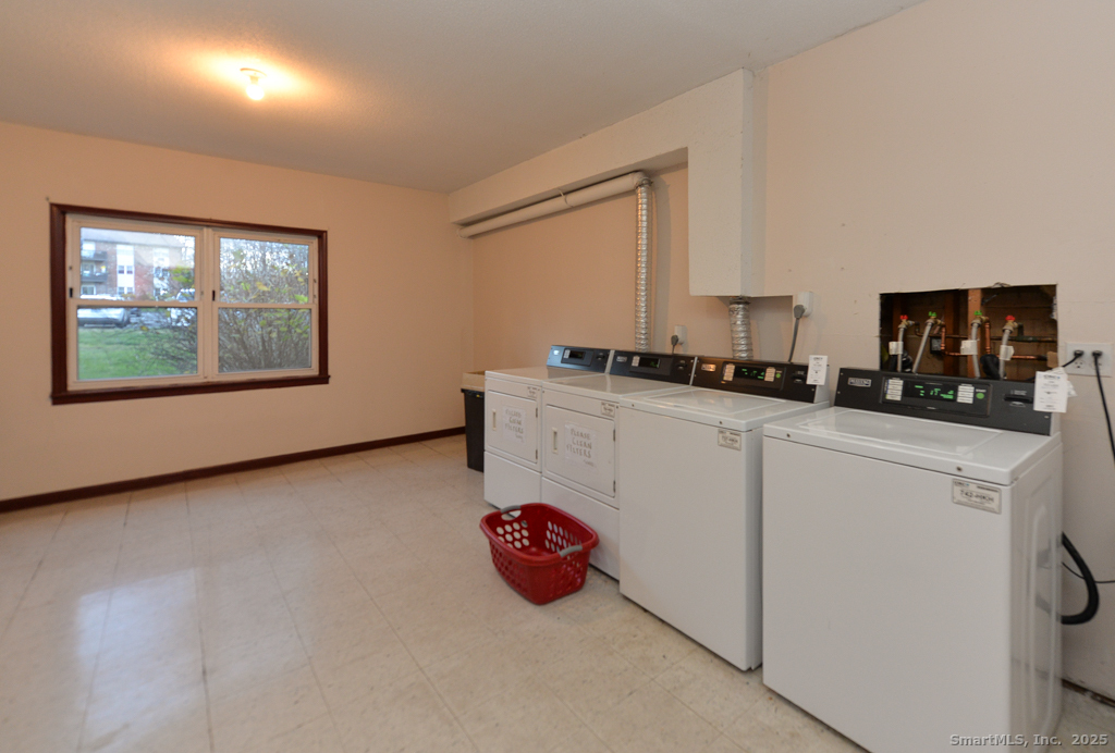 93 Balance Rock Road, Unit 1 Seymour, CT 06483 - Photo 13 of 15 a kitchen with stainless steel appliances granite countertop a stove a sink and a microwave