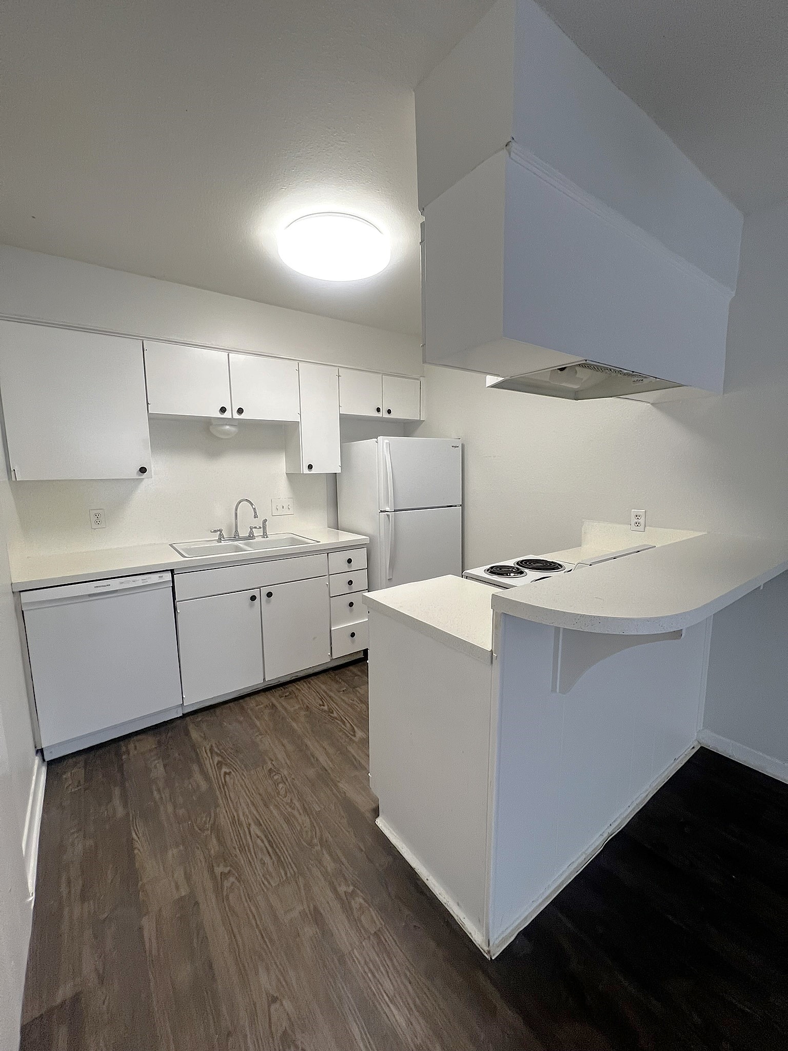 1037 East 44th Street, Unit 101 Austin, TX 78751 - Photo 2 of 9 a view of a kitchen with sink and cabinets