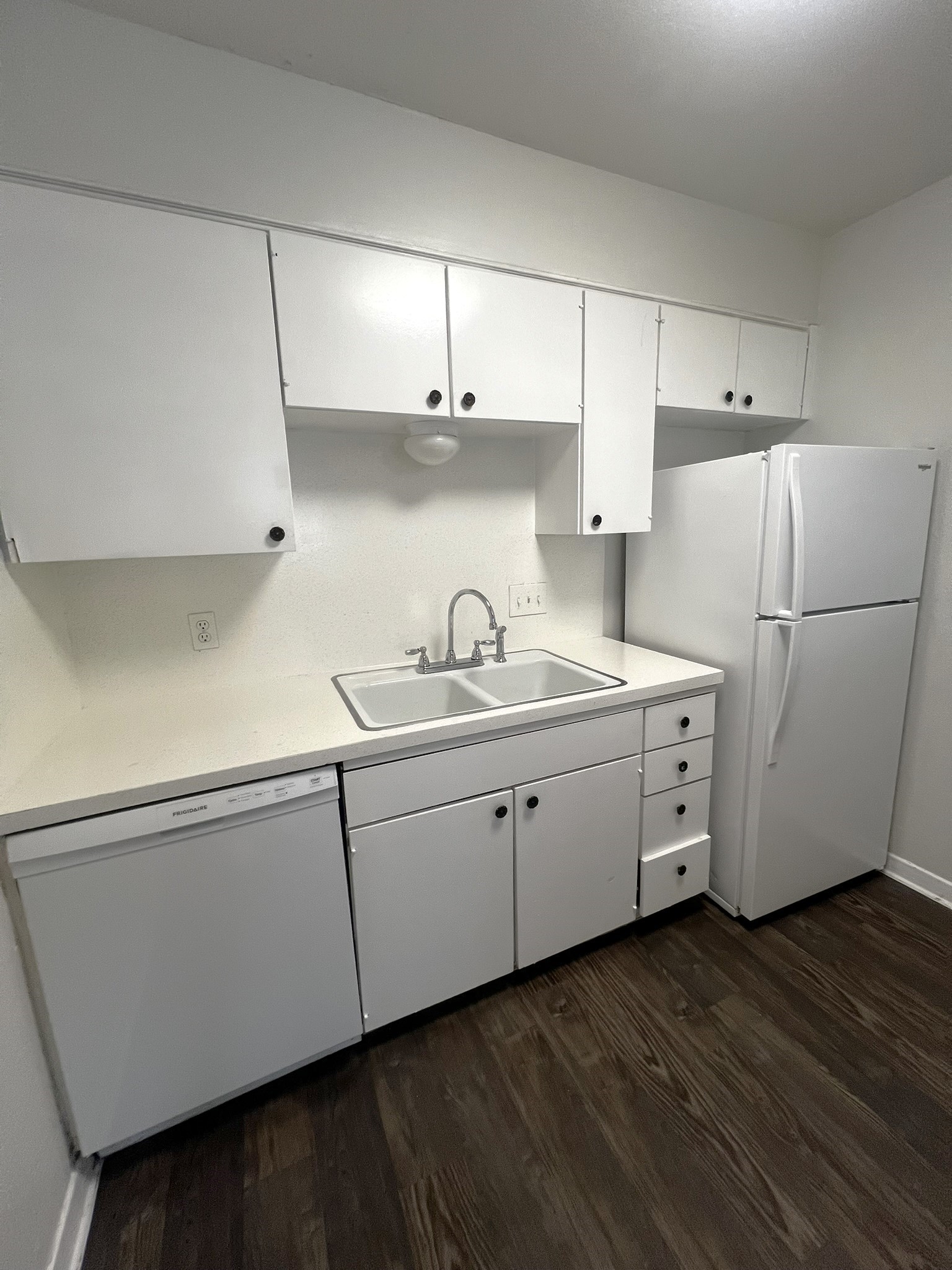 1037 East 44th Street, Unit 101 Austin, TX 78751 - Photo 3 of 9 a kitchen with cabinets and a refrigerator