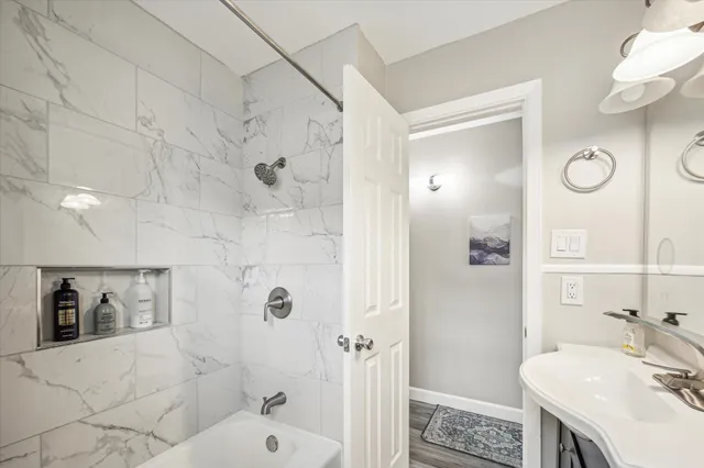 a bathroom with a sink toilet and shower