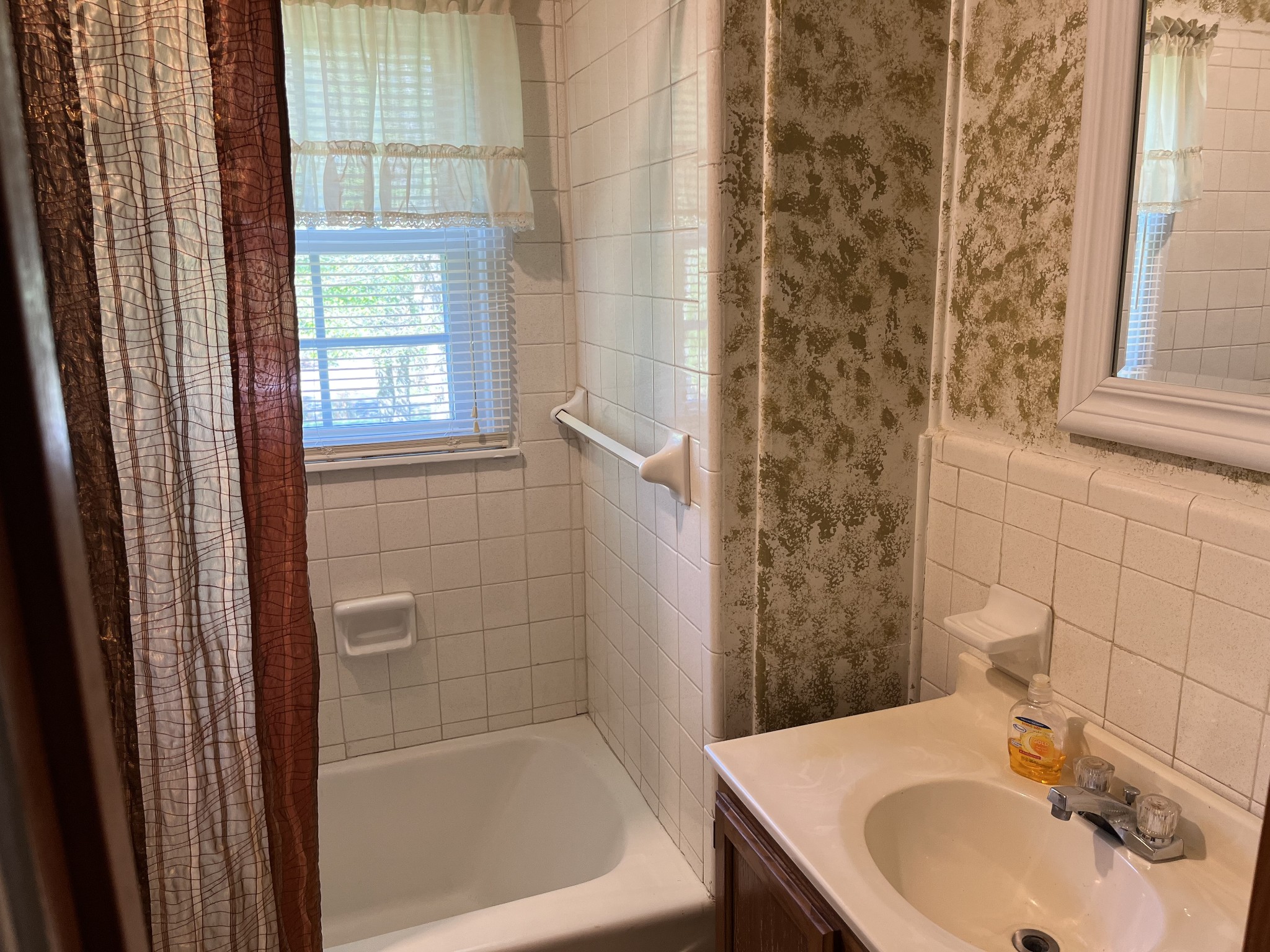 1716 New Hope Road Joelton, TN 37080 - Photo 14 of 23 a bathroom with a sink a bathtub and shower