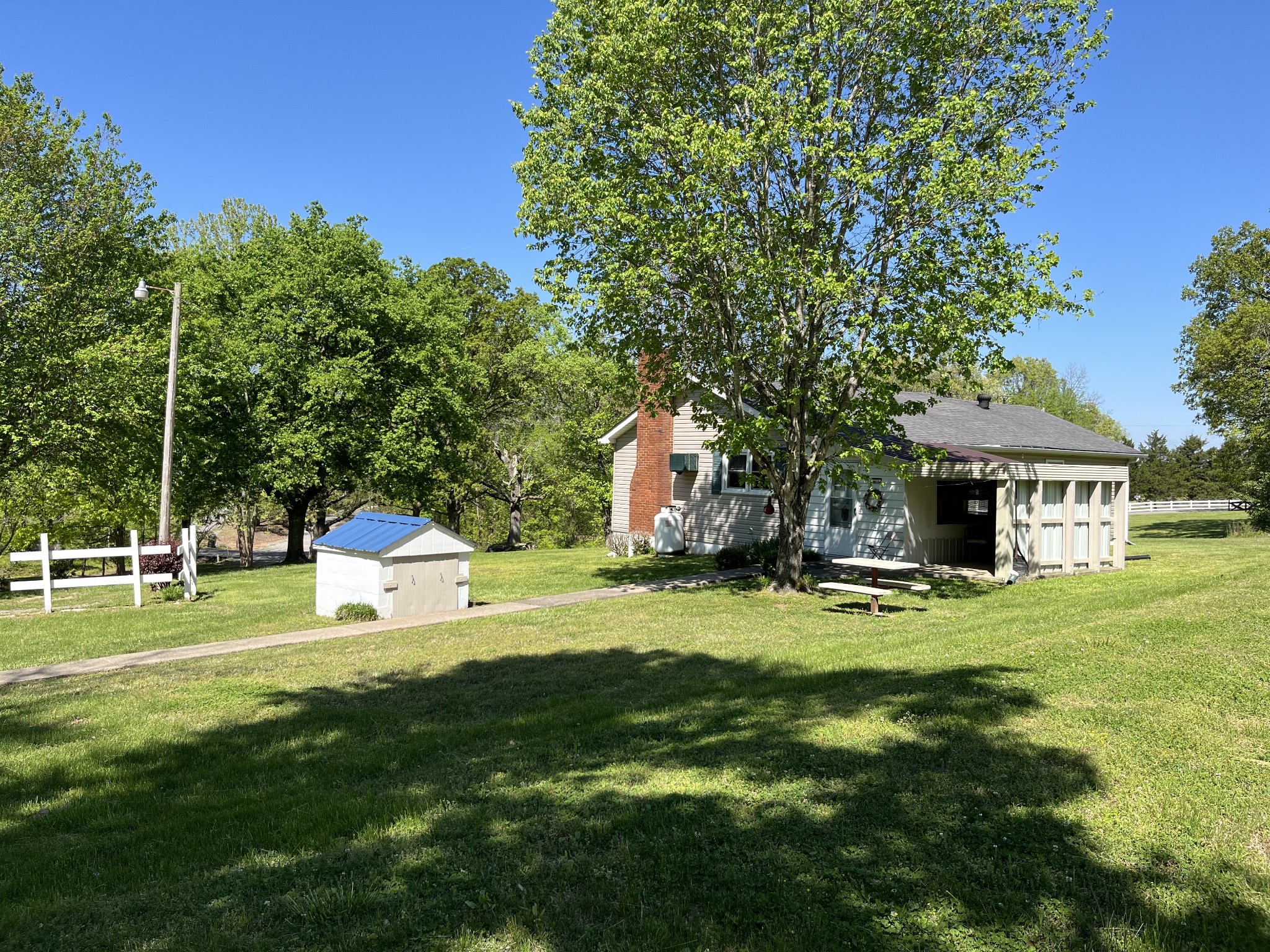 1716 New Hope Road Joelton, TN 37080 - Photo 21 of 23 a backyard of a house with table and chairs