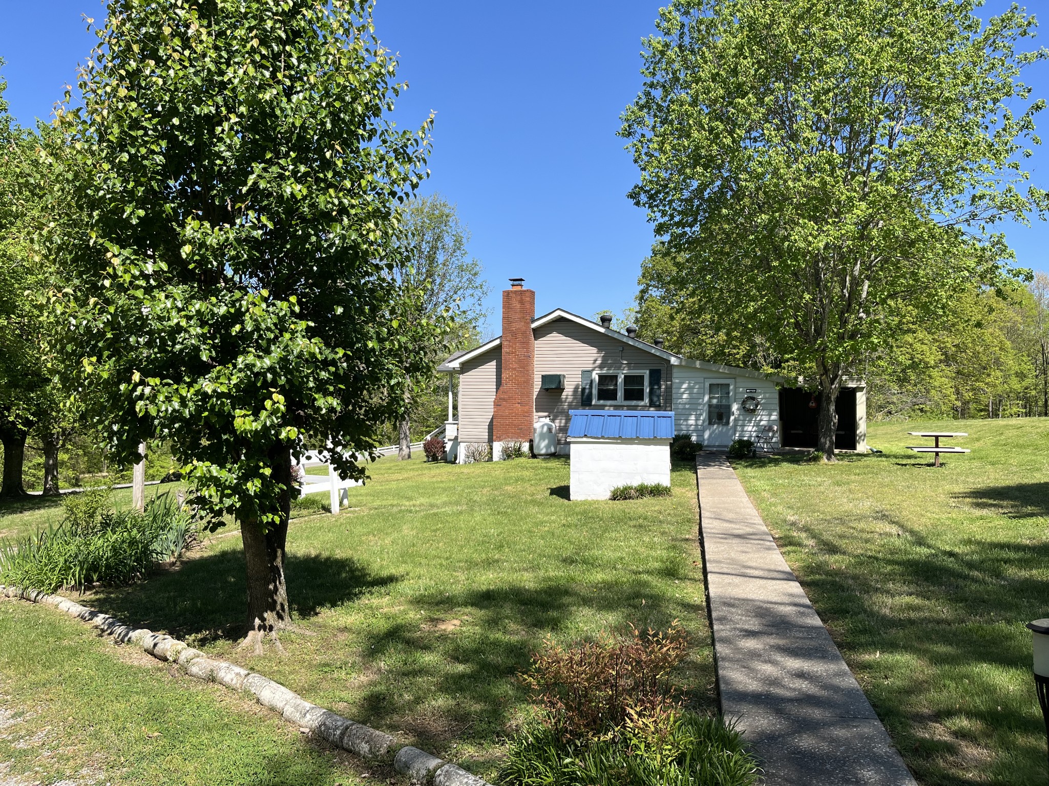 1716 New Hope Road Joelton, TN 37080 - Photo 22 of 23 a front view of a house with a yard and trees