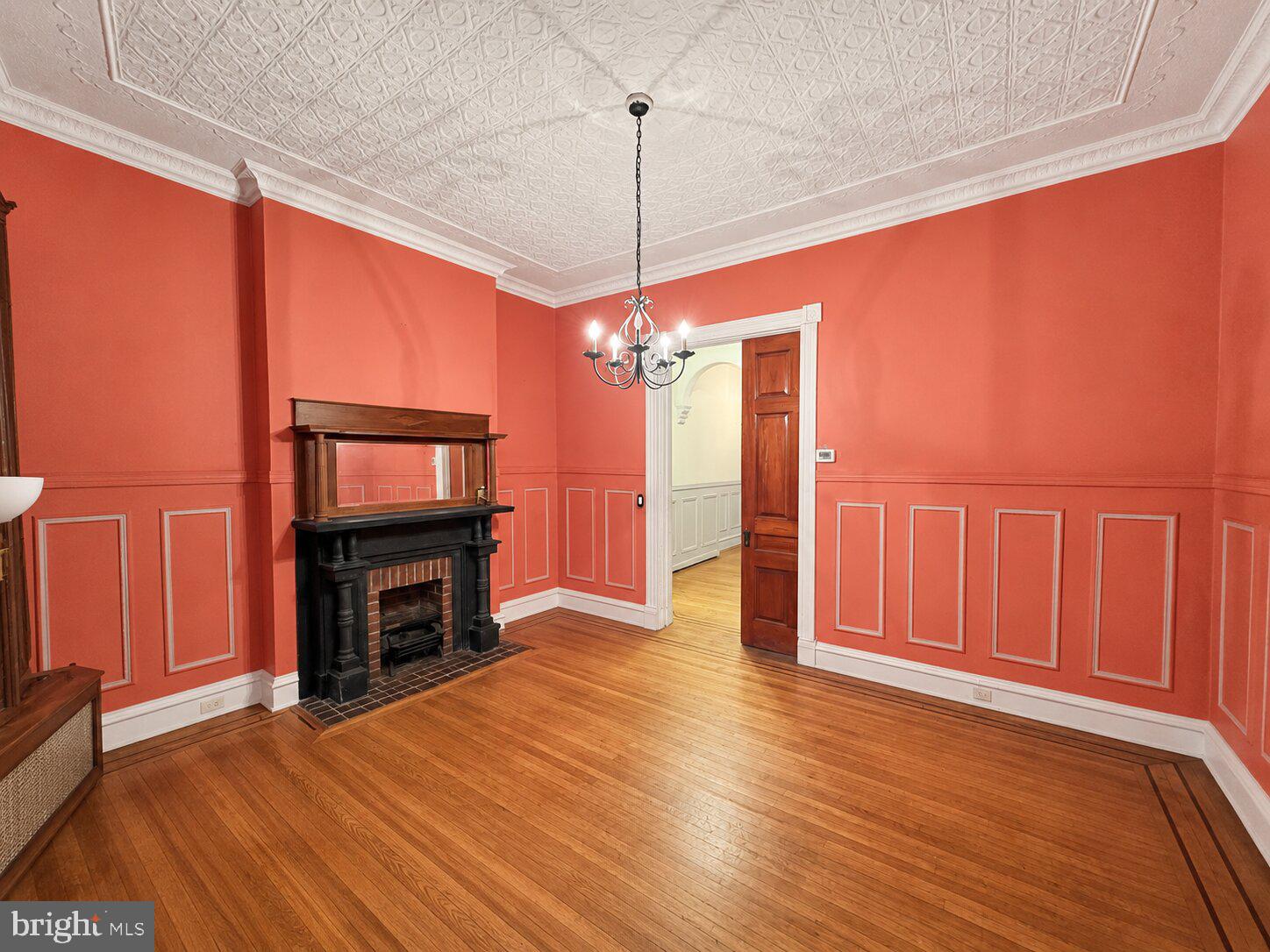 1908 Madison Avenue Baltimore, MD 21217 - Photo 3 of 31 a view of livingroom with furniture flat screen tv and refrigerator