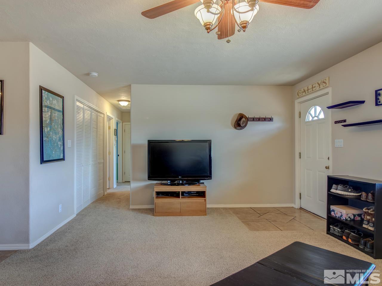 805 Hidden Canyon Road Reno, NV 89510 - Photo 21 of 24 a living room with furniture and a flat screen tv