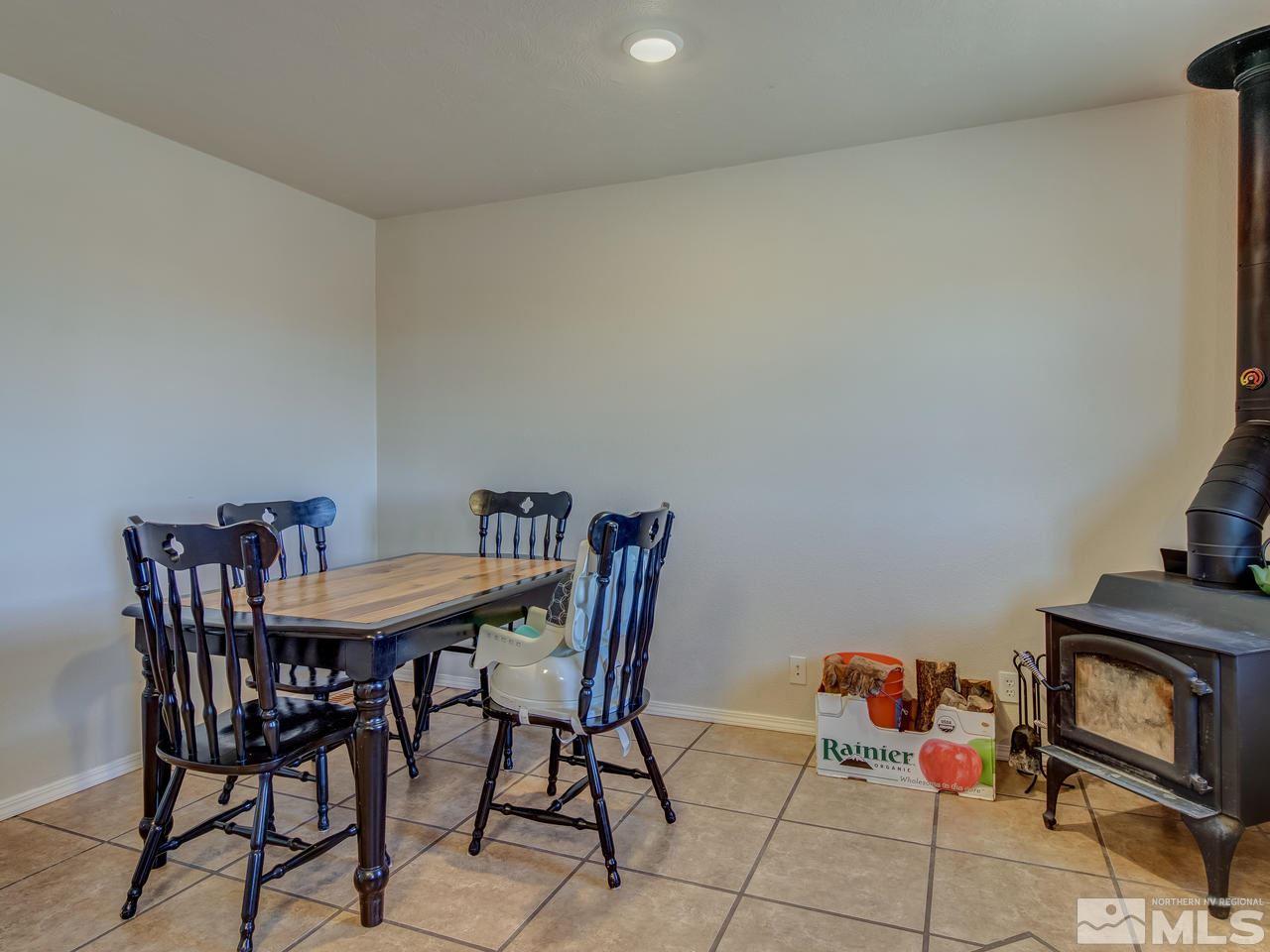 805 Hidden Canyon Road Reno, NV 89510 - Photo 8 of 24 a view of a dining room with furniture and a kitchen