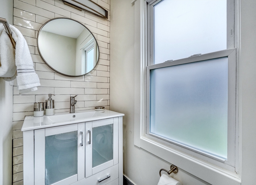 14 Paul Road Medford, MA 02155 - Photo 11 of 42 a bathroom with a sink and a mirror
