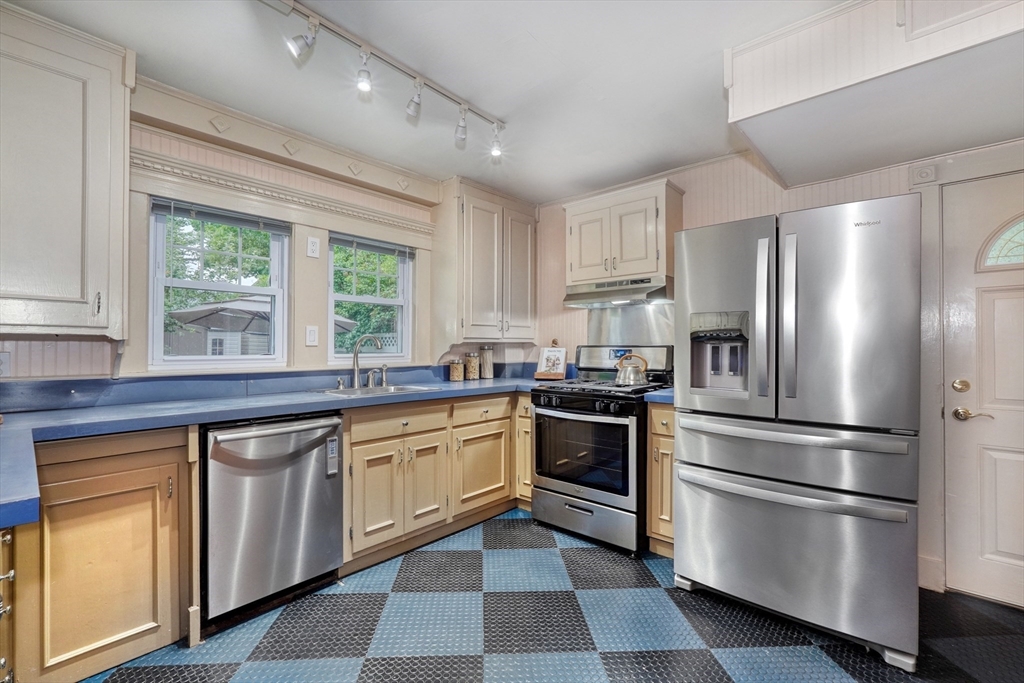 14 Paul Road Medford, MA 02155 - Photo 13 of 42 a kitchen with stainless steel appliances granite countertop a refrigerator sink and stove