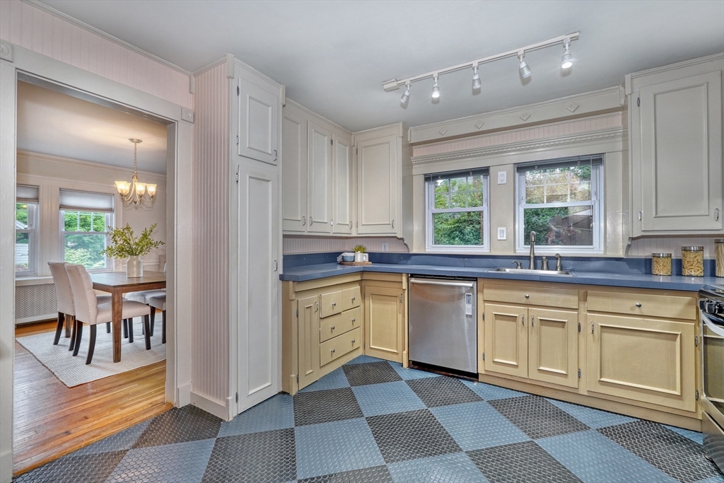 14 Paul Road Medford, MA 02155 - Photo 14 of 42 a kitchen with granite countertop a sink window and cabinets