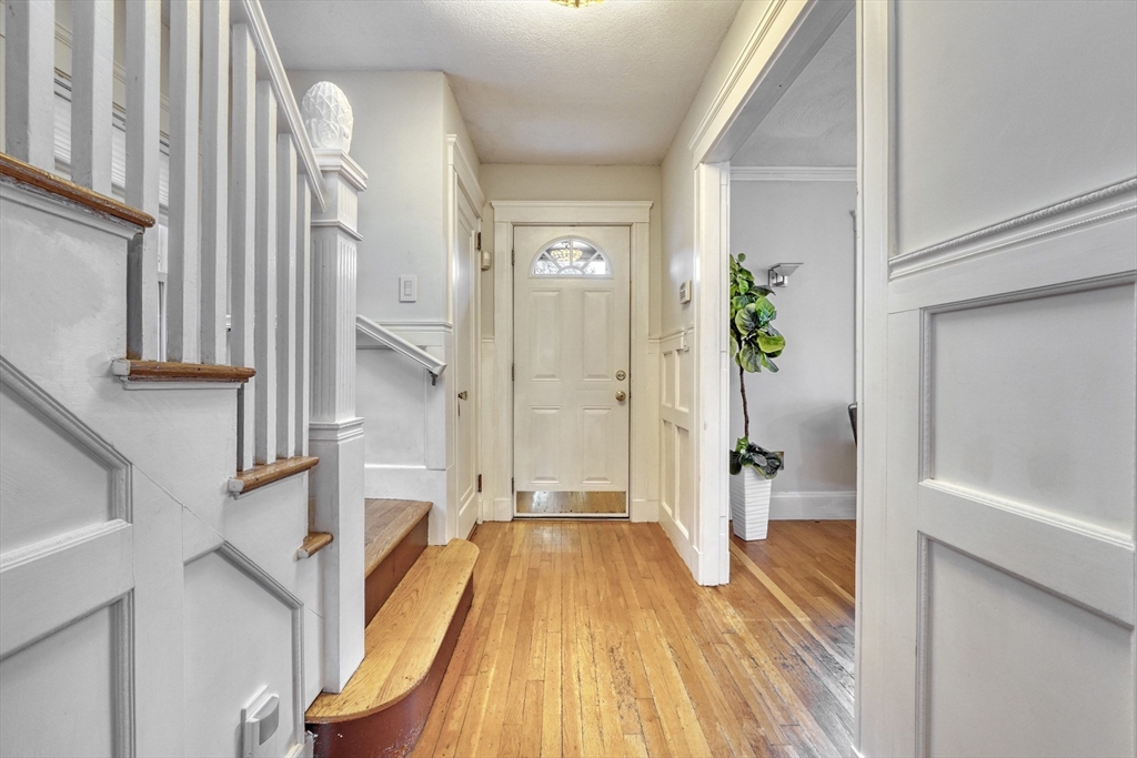 14 Paul Road Medford, MA 02155 - Photo 16 of 42 a view of a living room filled with furniture and entryway