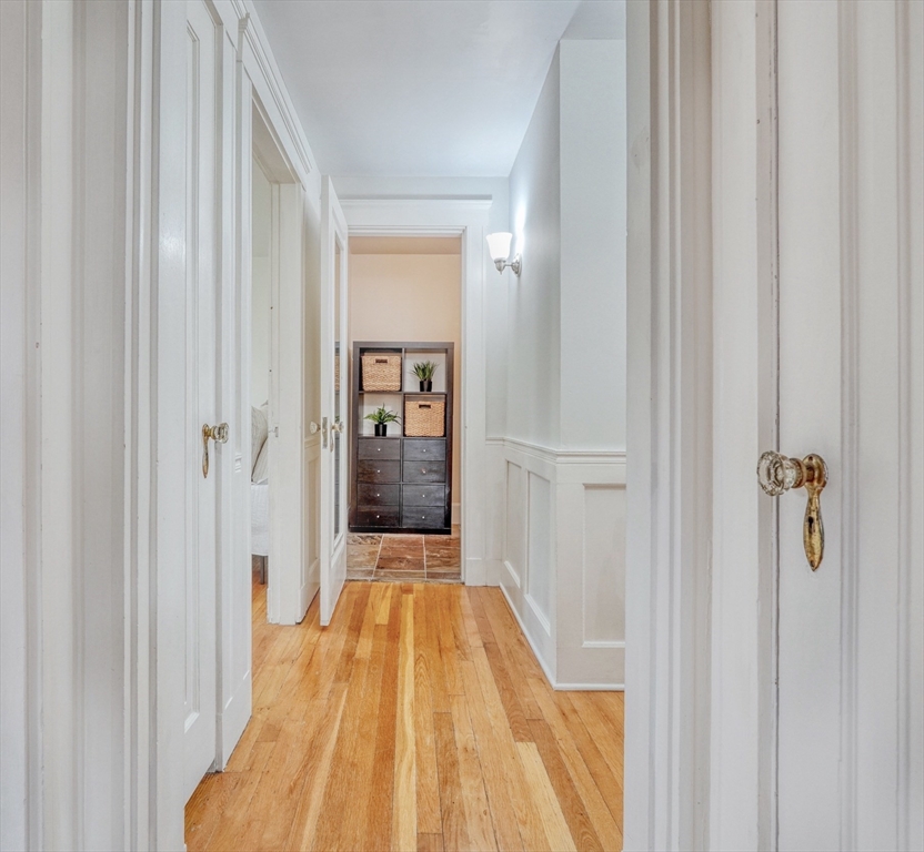 14 Paul Road Medford, MA 02155 - Photo 20 of 42 a view of a hallway with wooden floor and staircase