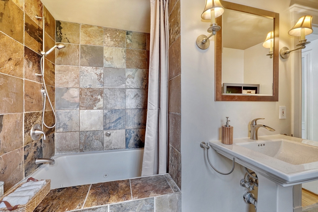 14 Paul Road Medford, MA 02155 - Photo 21 of 42 a bathroom with a sink and a mirror