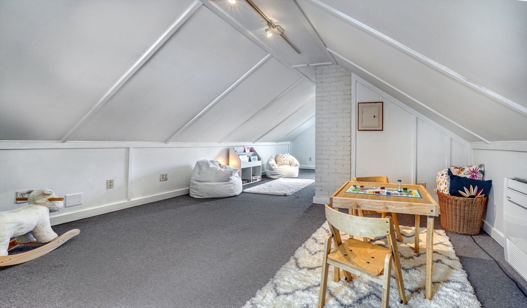 14 Paul Road Medford, MA 02155 - Photo 23 of 42 a bedroom with furniture and a table