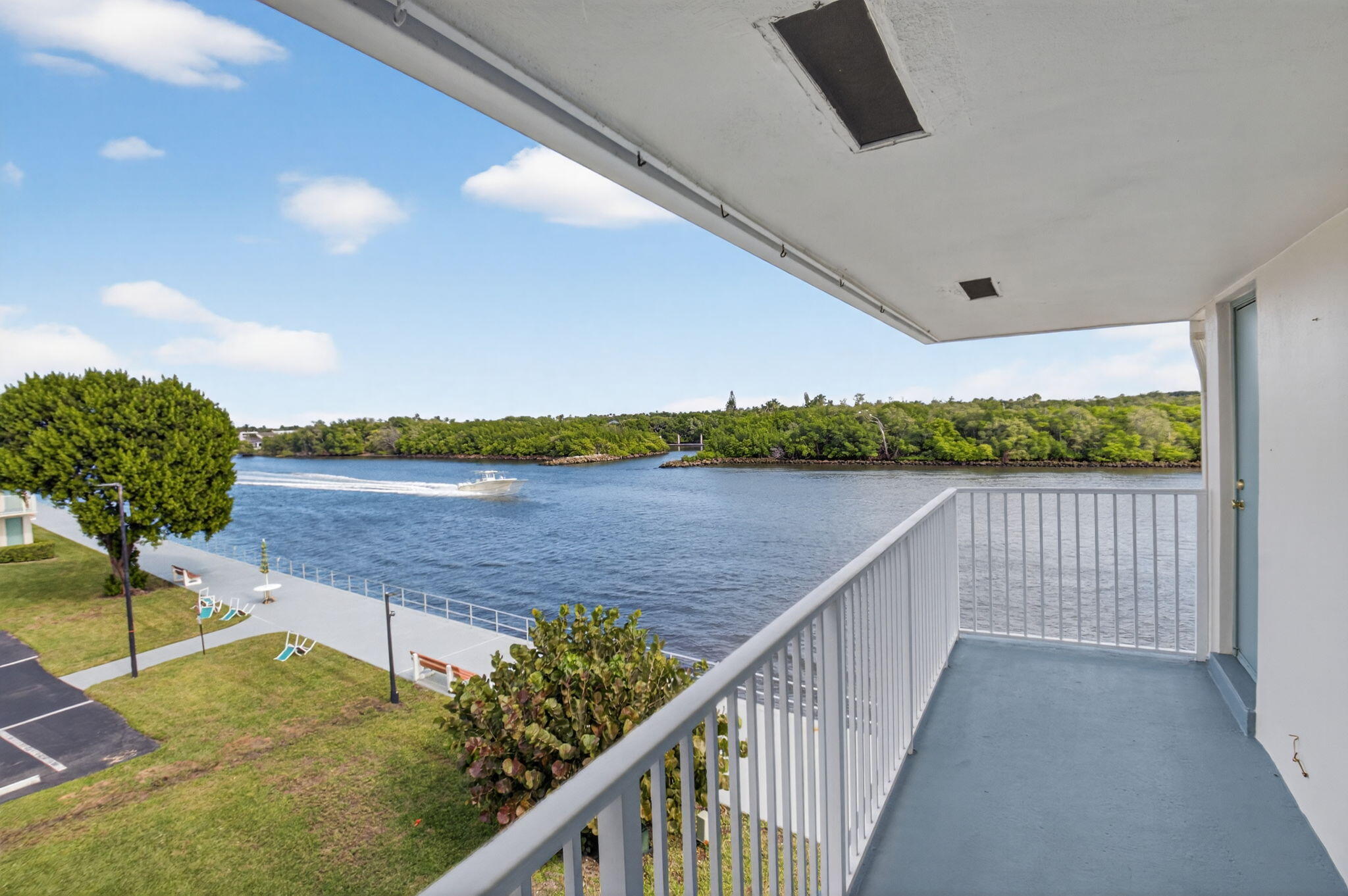 770 Horizon Street East, Unit 311 Boynton Beach, FL 33435 - Photo 15 of 52 a view of a lake from a balcony