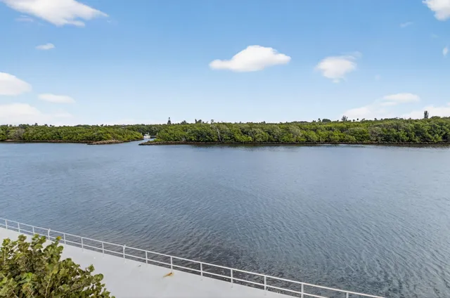 a living room with furniture a dining table and a flat screen tv