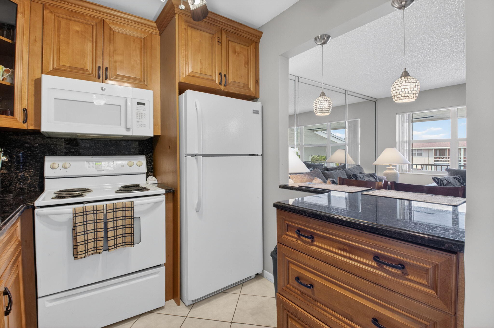 770 Horizon Street East, Unit 311 Boynton Beach, FL 33435 - Photo 20 of 52 a kitchen with a appliances a sink and cabinets