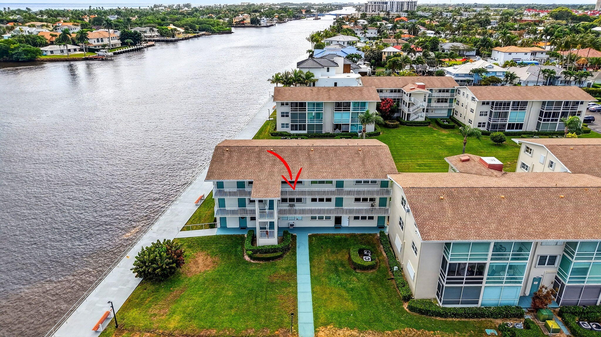 770 Horizon Street East, Unit 311 Boynton Beach, FL 33435 - Photo 2 of 52 a aerial view of a house with a garden and lake view