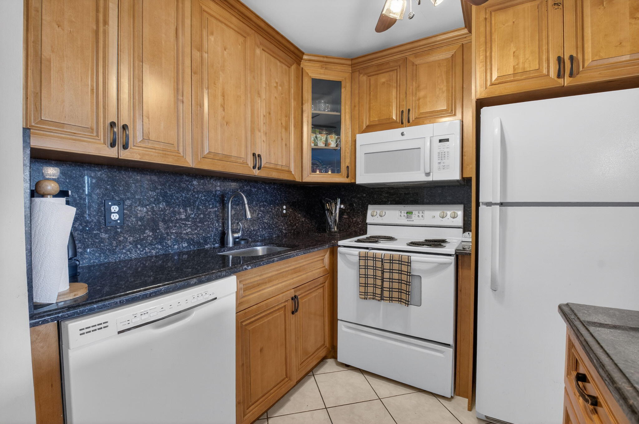 770 Horizon Street East, Unit 311 Boynton Beach, FL 33435 - Photo 21 of 52 a kitchen with cabinets appliances and a sink