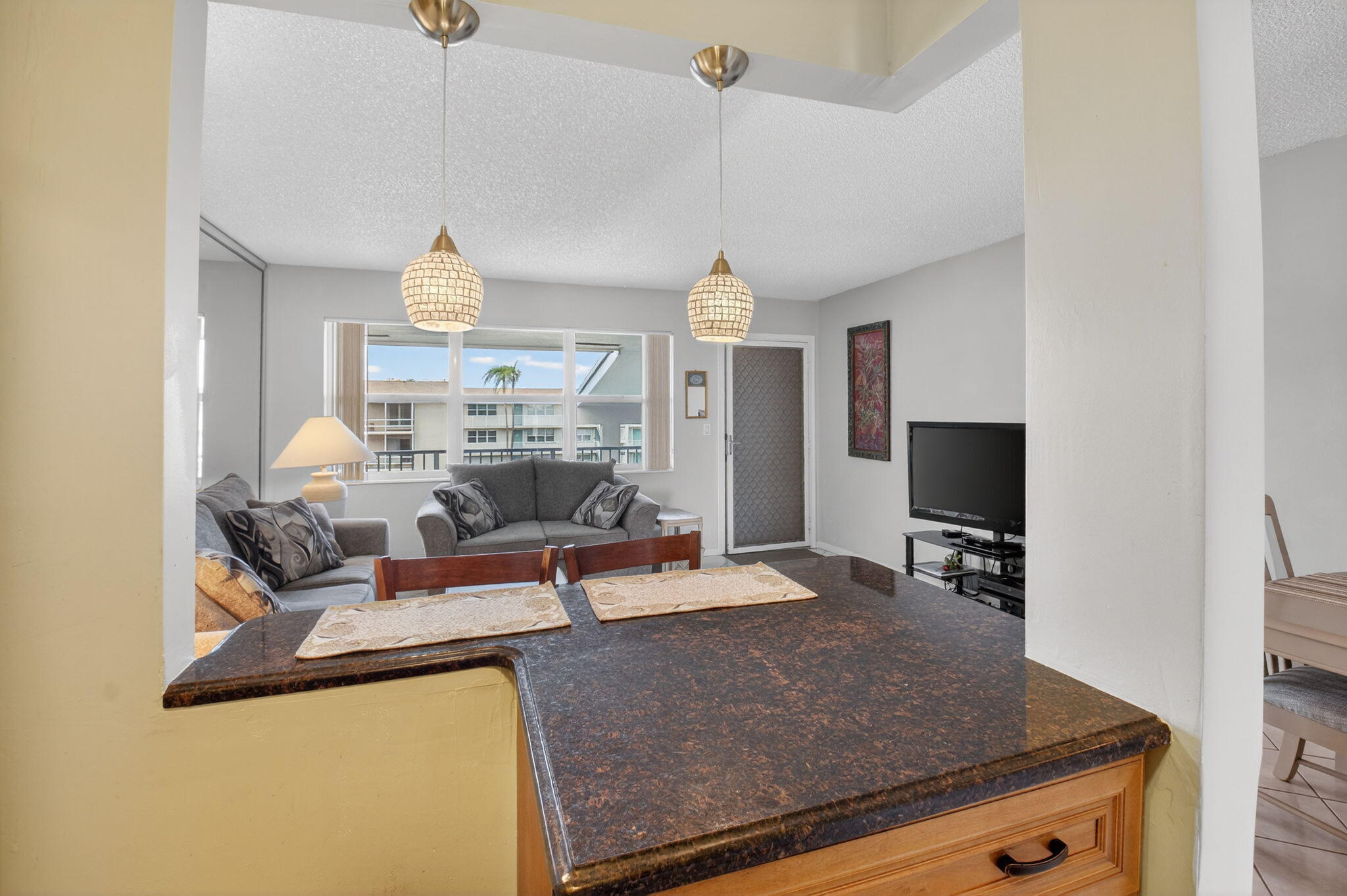 770 Horizon Street East, Unit 311 Boynton Beach, FL 33435 - Photo 22 of 52 a living room with furniture and a flat screen tv