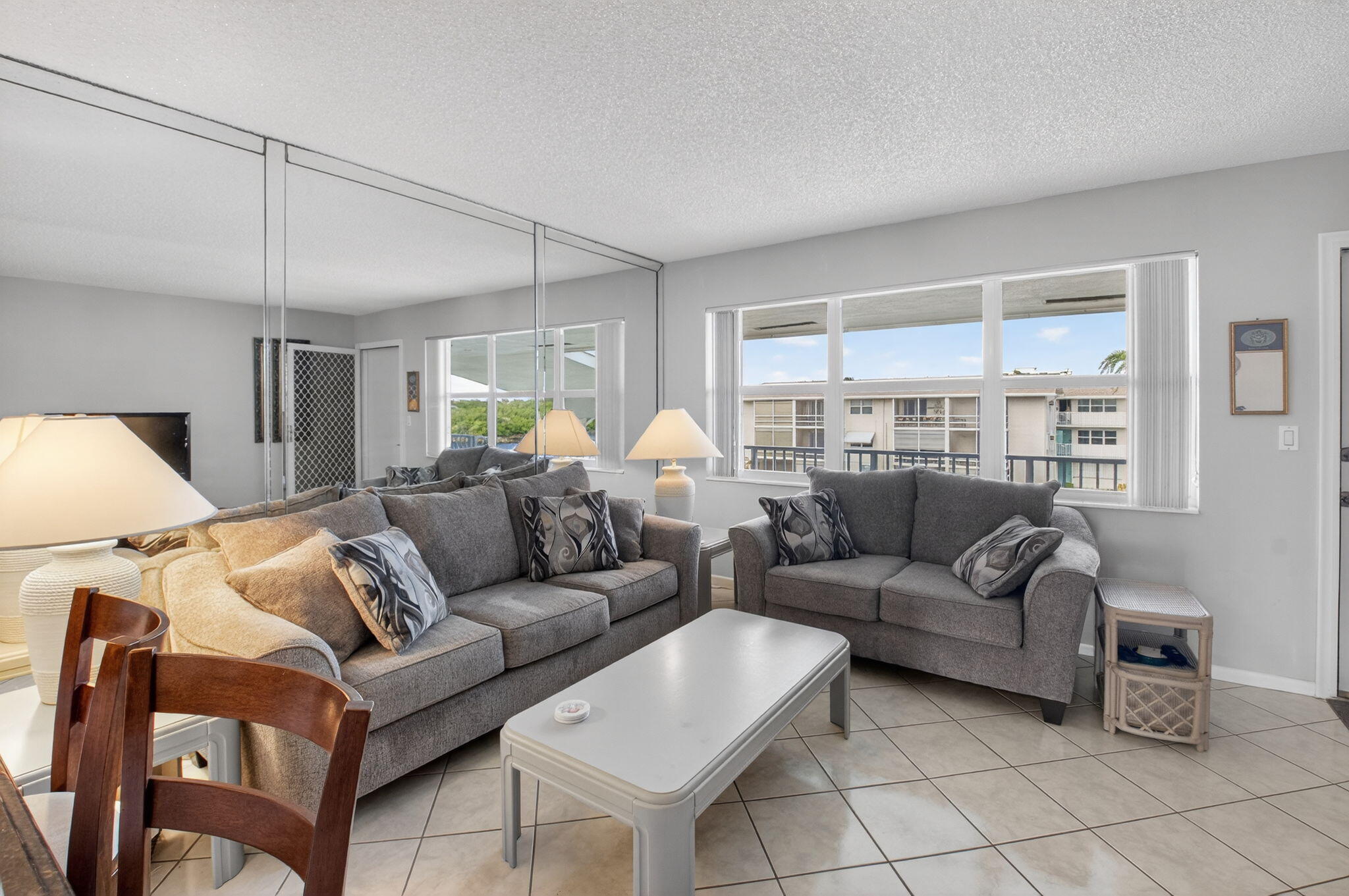 770 Horizon Street East, Unit 311 Boynton Beach, FL 33435 - Photo 25 of 52 a living room with furniture and a large window