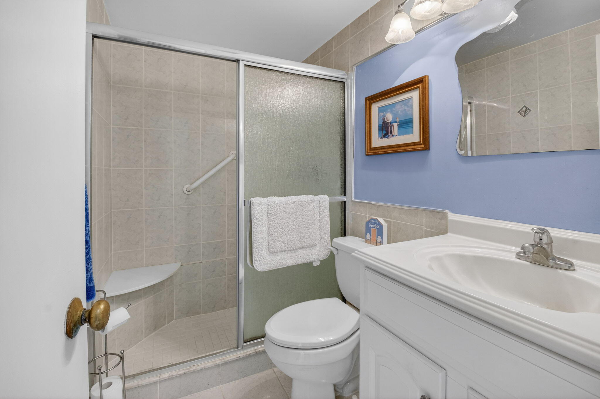 770 Horizon Street East, Unit 311 Boynton Beach, FL 33435 - Photo 31 of 52 a white toilet sitting next to a bathroom sink