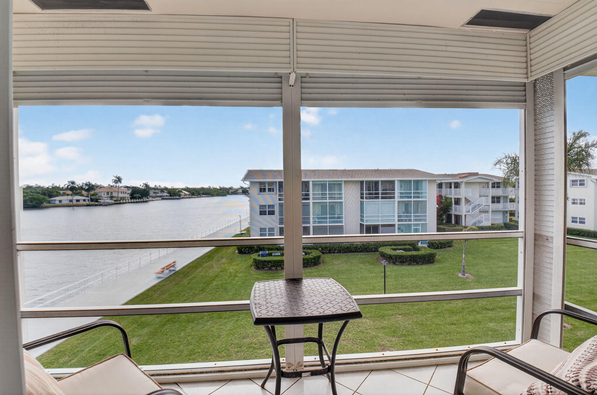 770 Horizon Street East, Unit 311 Boynton Beach, FL 33435 - Photo 34 of 52 a view of a chairs and table on the terrace window