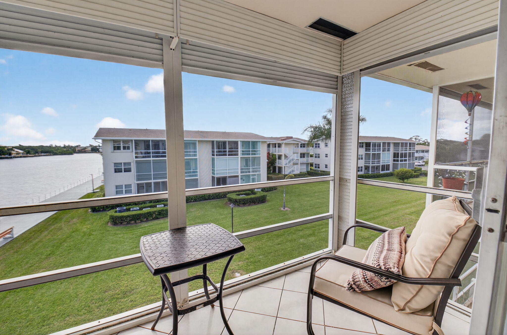 770 Horizon Street East, Unit 311 Boynton Beach, FL 33435 - Photo 35 of 52 a view of a chairs in backyard of a house