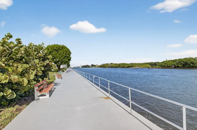 a view of a terrace with outdoor seating and lake