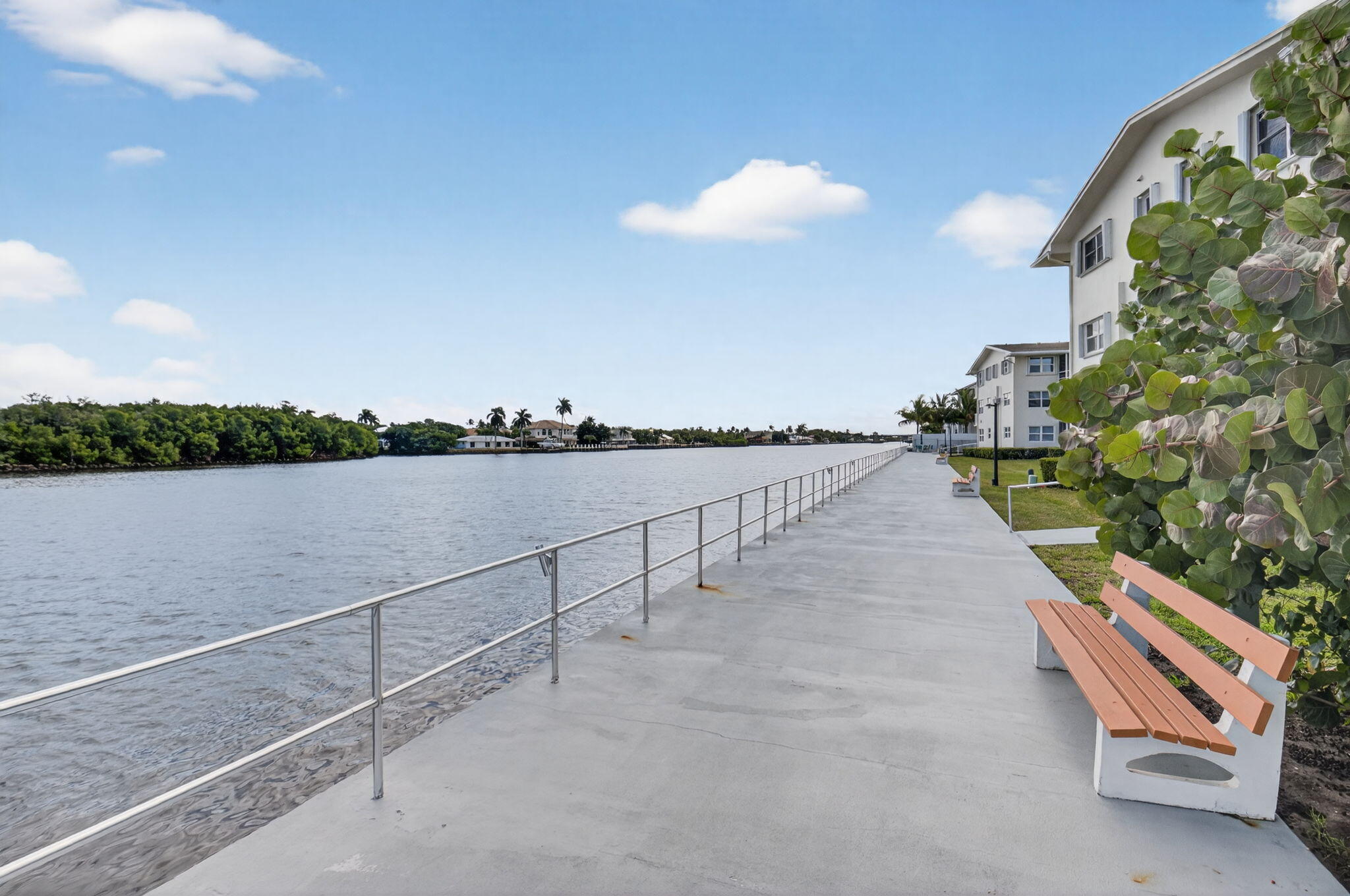 770 Horizon Street East, Unit 311 Boynton Beach, FL 33435 - Photo 38 of 52 a view of a terrace with outdoor seating and lake