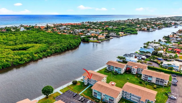 an aerial view of a house with a lake view