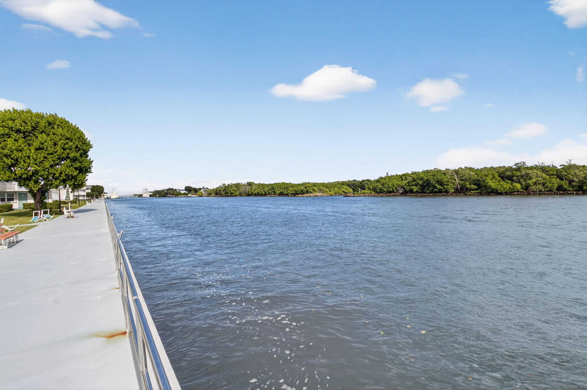 770 Horizon Street East, Unit 311 Boynton Beach, FL 33435 - Photo 41 of 52 a view of a lake and a yard