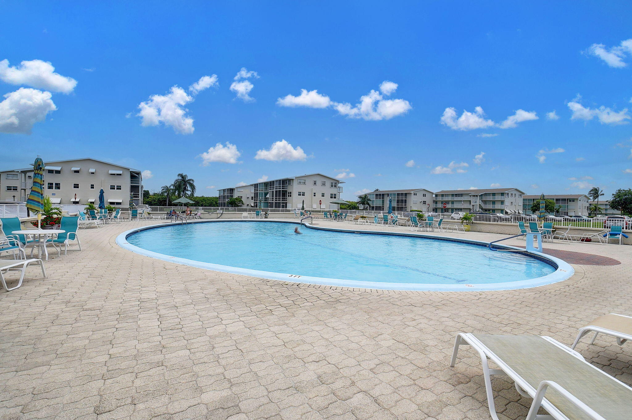 770 Horizon Street East, Unit 311 Boynton Beach, FL 33435 - Photo 51 of 52 a view of a swimming pool with outdoor seating