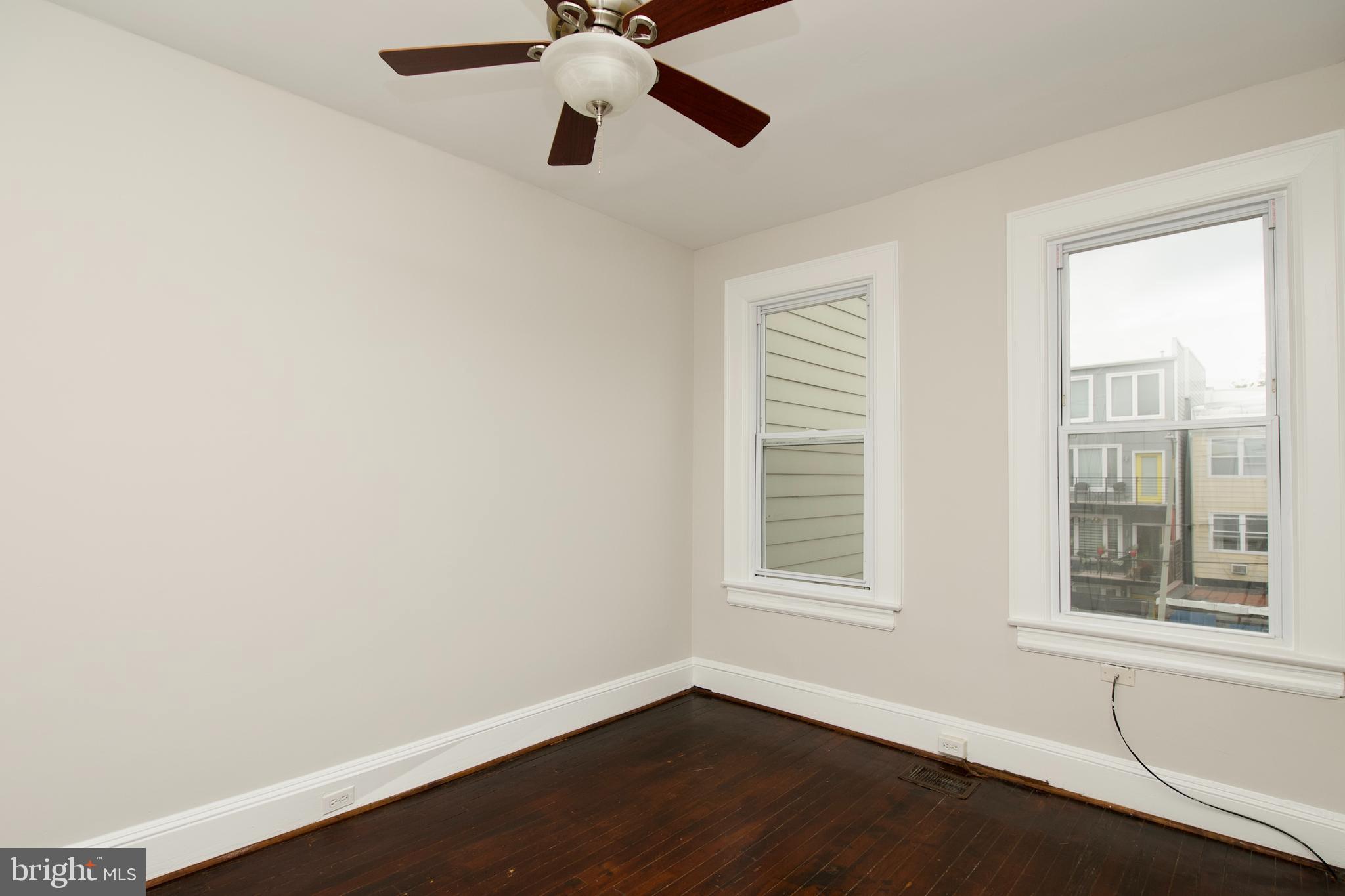 116 Todd Place Northeast Washington, DC 20002 - Photo 20 of 34 an empty room with a window and a ceiling fan