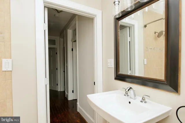 a view of an entryway with wooden floor