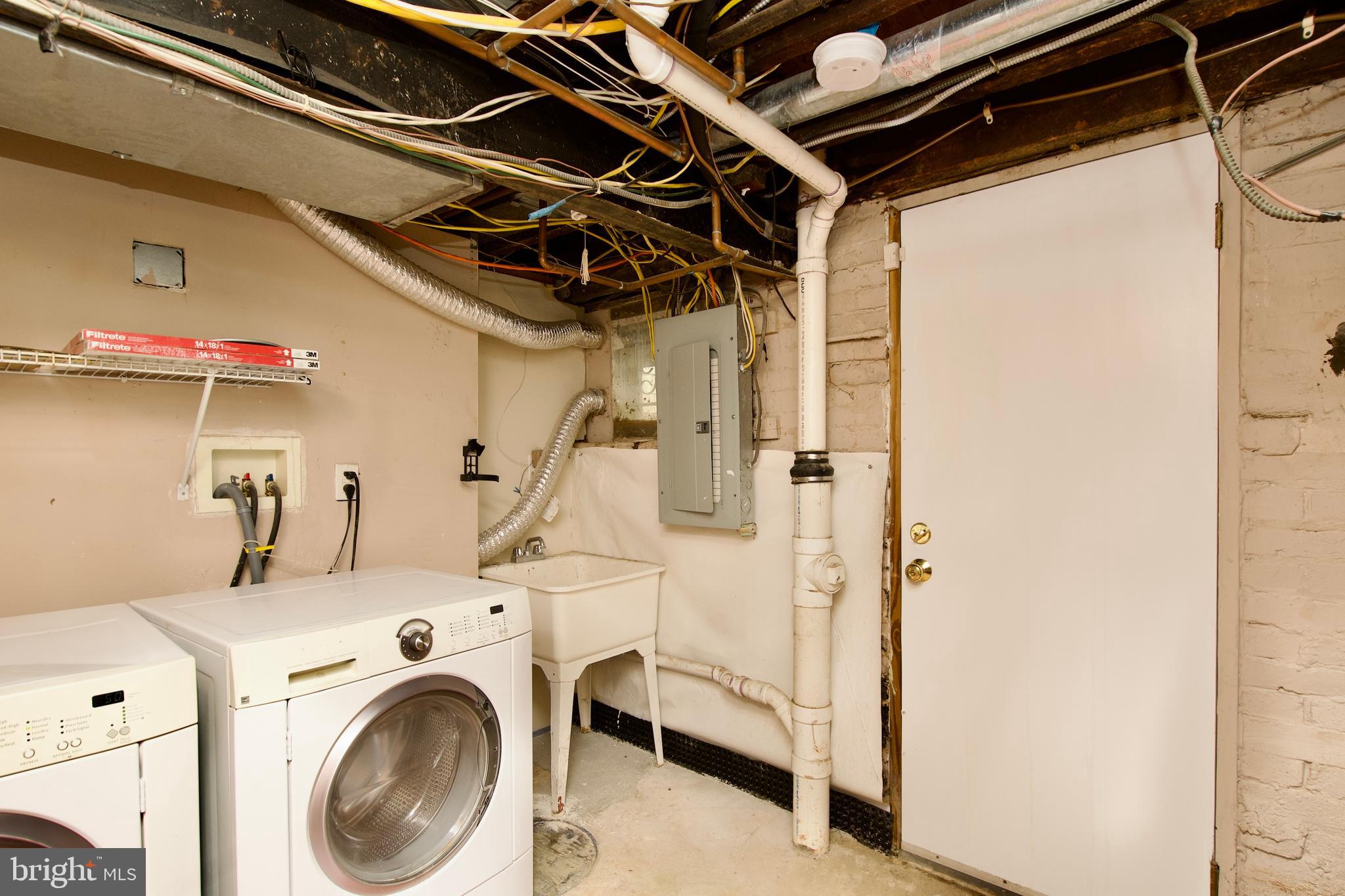 116 Todd Place Northeast Washington, DC 20002 - Photo 28 of 34 a view of storage and utility room with washer and dryer