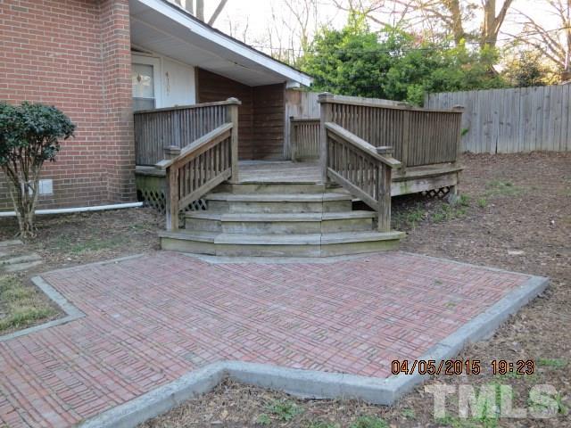 4107 North New Hope Road Raleigh, NC 27604 - Photo 3 of 10 a view of backyard with small deck and wooden fence