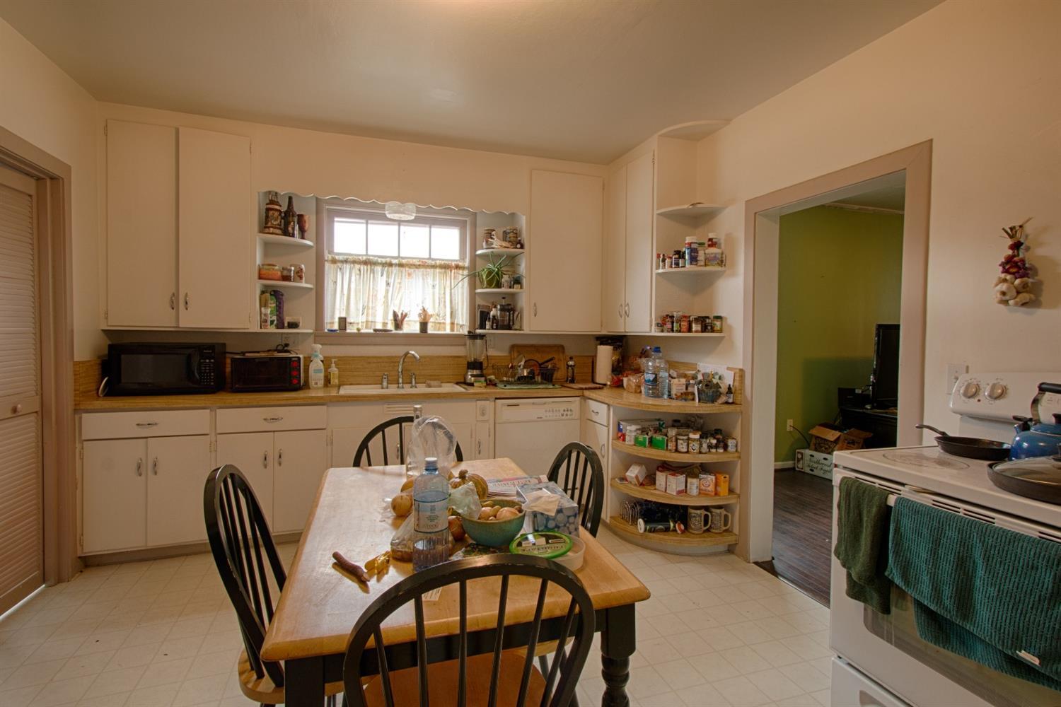 2712 Merriman Road Medford, OR 97501 - Photo 4 of 12 a view of a dining room with furniture and window