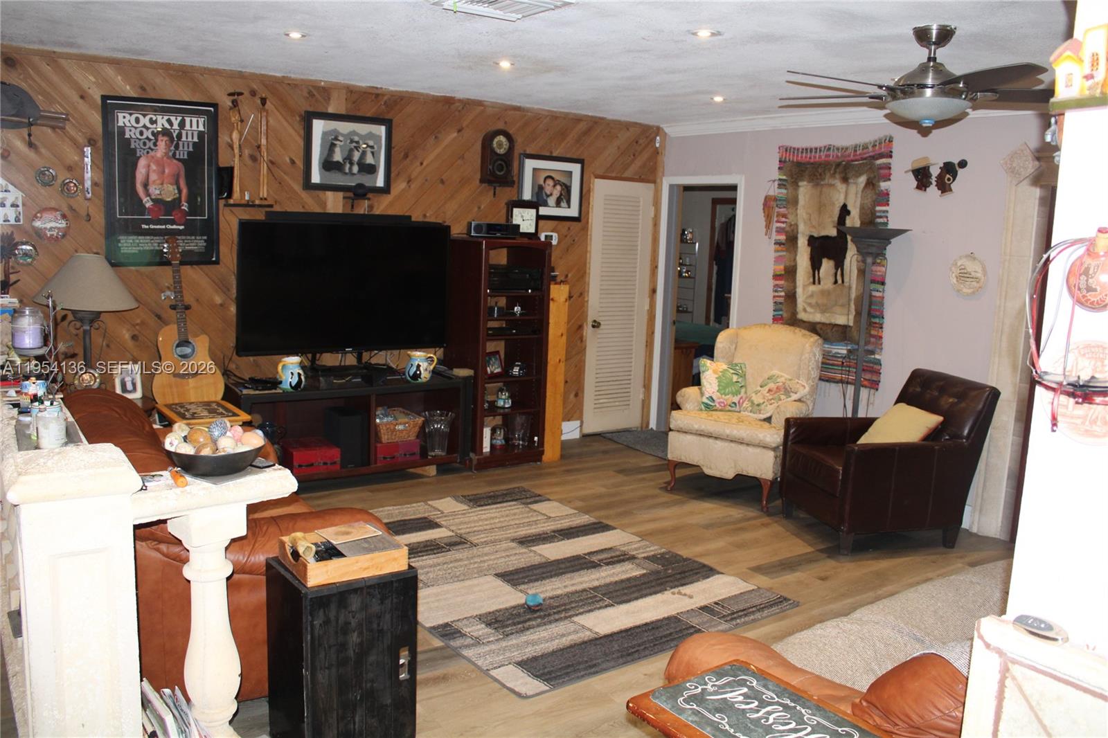 6030 Southwest 93rd Court Miami, FL 33173 - Photo 9 of 9 a living room with furniture and a flat screen tv