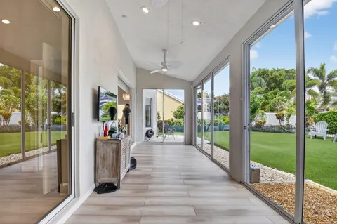 a view of a house with backyard porch and sitting area