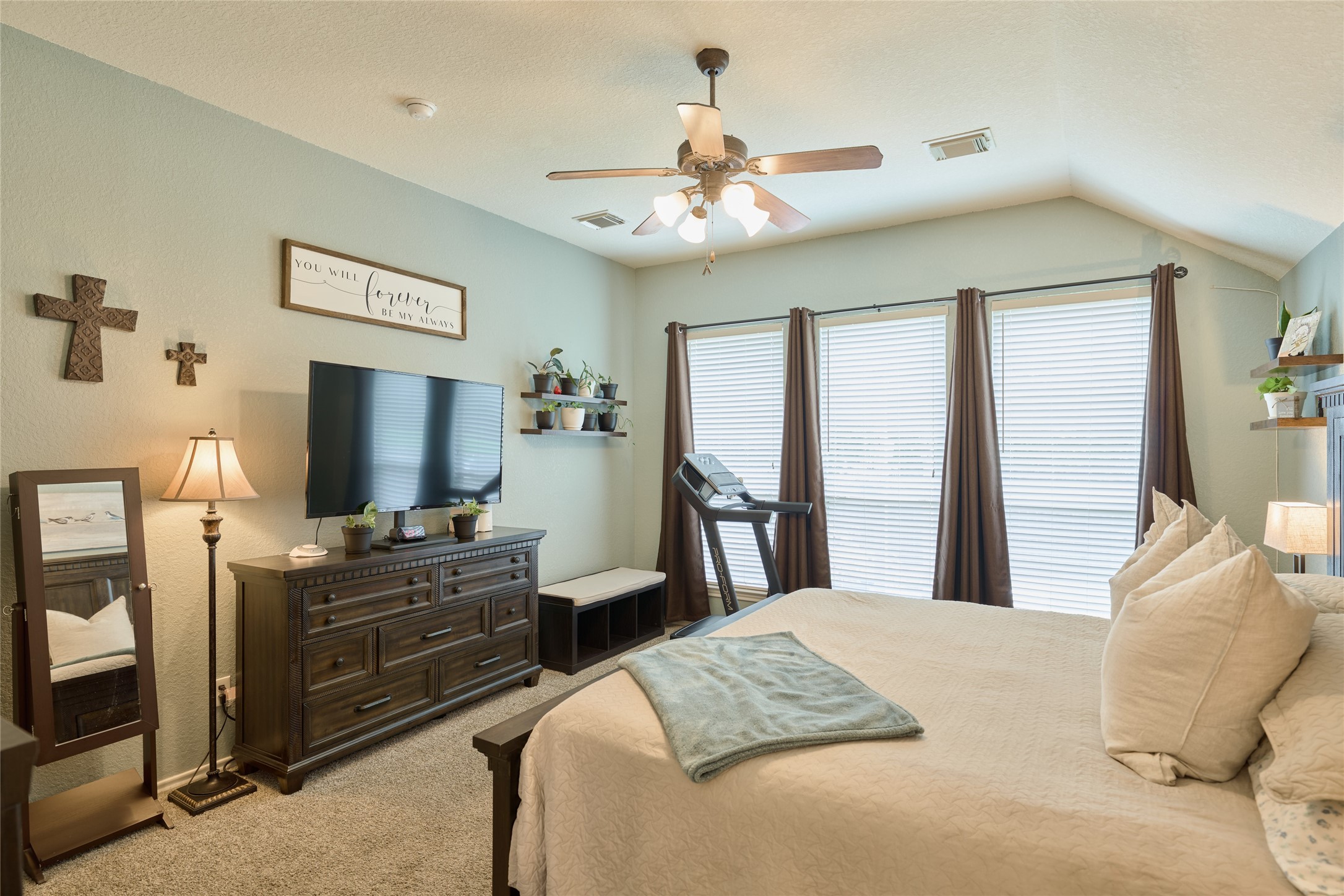 28322 Madelin Manor Lane Spring, TX 77386 - Photo 16 of 46 a bedroom with a bed and a flat tv screen on dresser