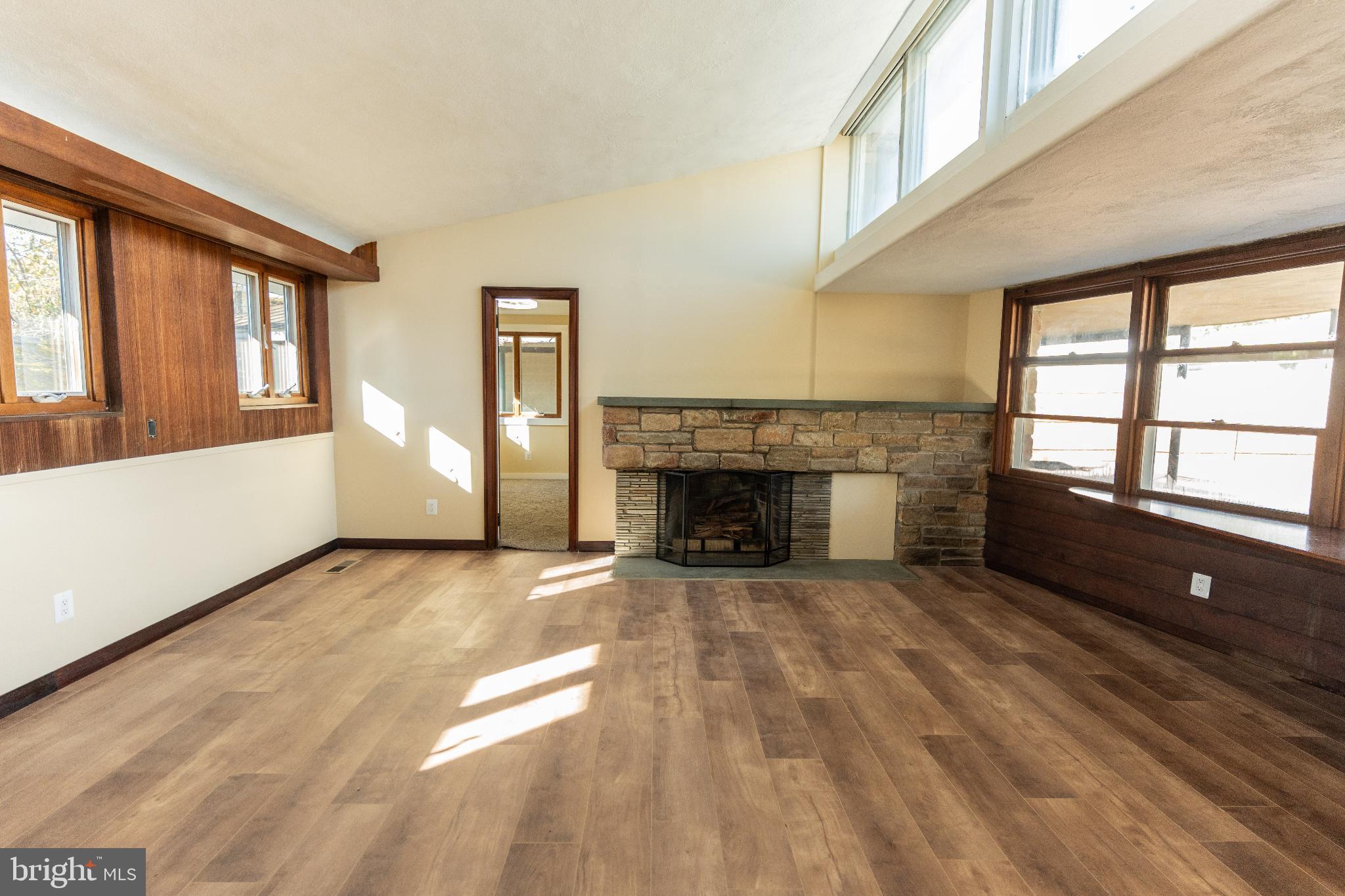 102 East Washington Street, Unit B Remington, VA 22734 - Photo 11 of 21 a view of an empty room with a fireplace and a window